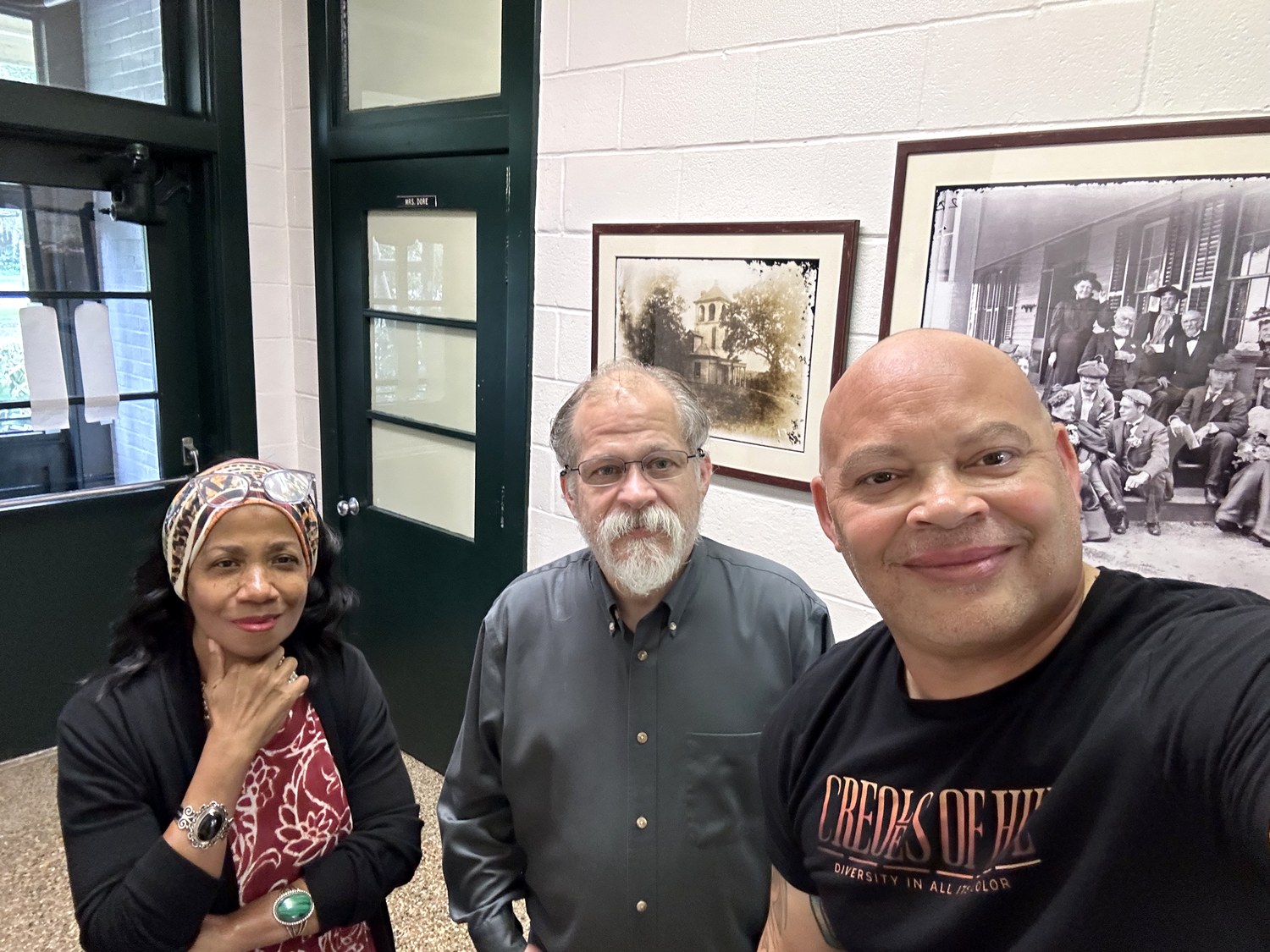 Ruth Foote, at left in a headwrap, with two others at a gallery opening of a Creole portrait series